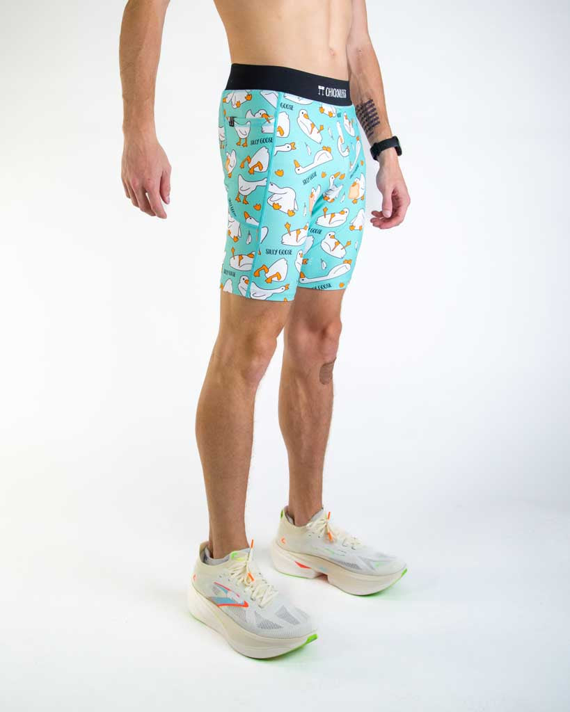 Right side view of ChicknLegs Men’s 8-inch Half Tights highlighting the dual side pockets, supportive mesh liner, and smooth waistband that stays in place during movement.