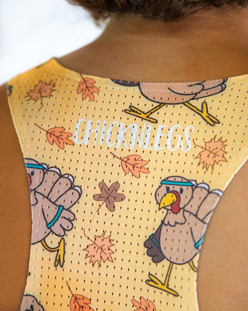 Close-up detail of ChicknLegs Performance Running Singlet fabric, showing lightweight material, seamless stitching, and mesh texture for breathability.