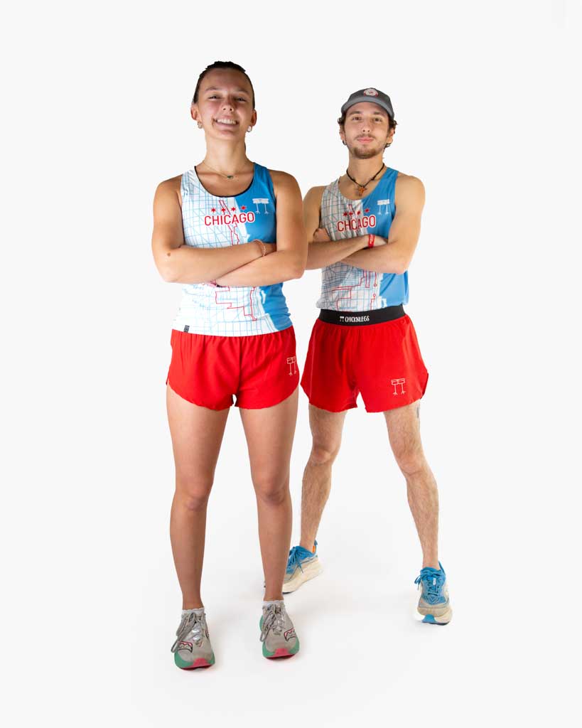 Two runners are shown wearing ChicknLegs in the performance running singlet in the Chicago Marathon design. Both are styled in blue shoes with matching red shorts.