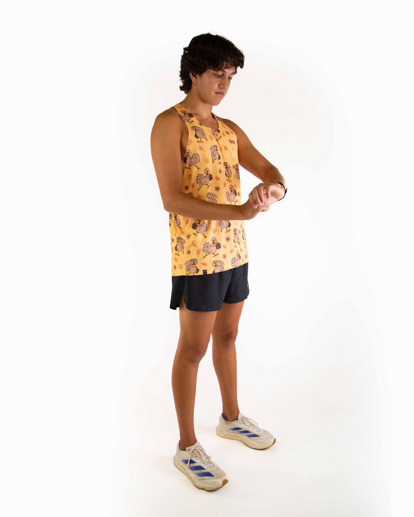 Full body view of model wearing the ChicknLegs Performance Running Singlet, featuring lightweight, breathable construction with mesh back panel and seamless armholes for a comfortable fit.