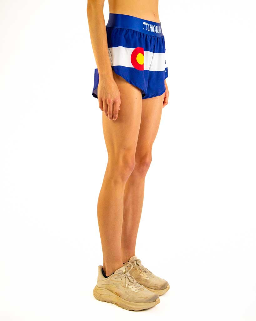 Right side view of ChicknLegs Women’s 1.5-inch split running shorts highlighting the soft elastic waistband, breathable black mesh liner, and athletic side split.