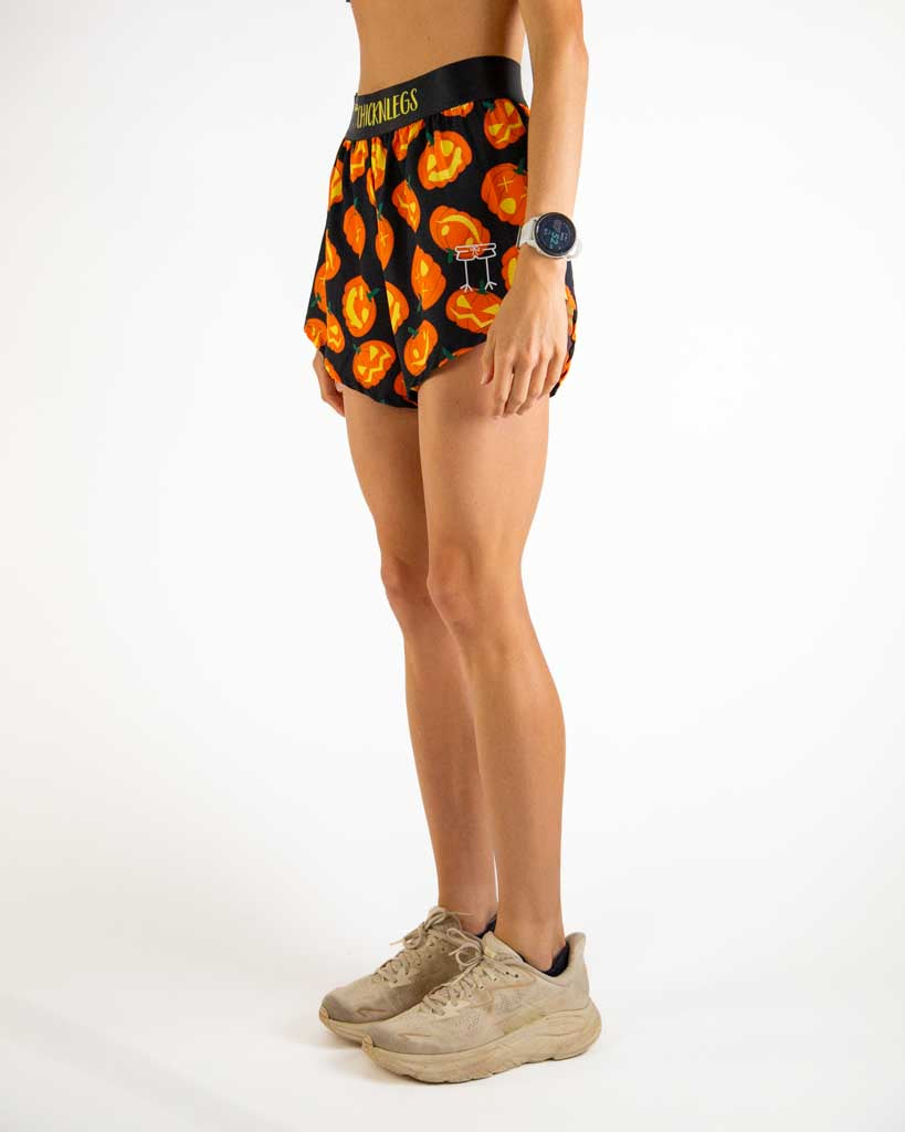 Left side view of ChicknLegs Women’s 4-inch split running shorts showing the 3-inch side split for mobility, lightweight fabric, and smooth waistband that stays in place.