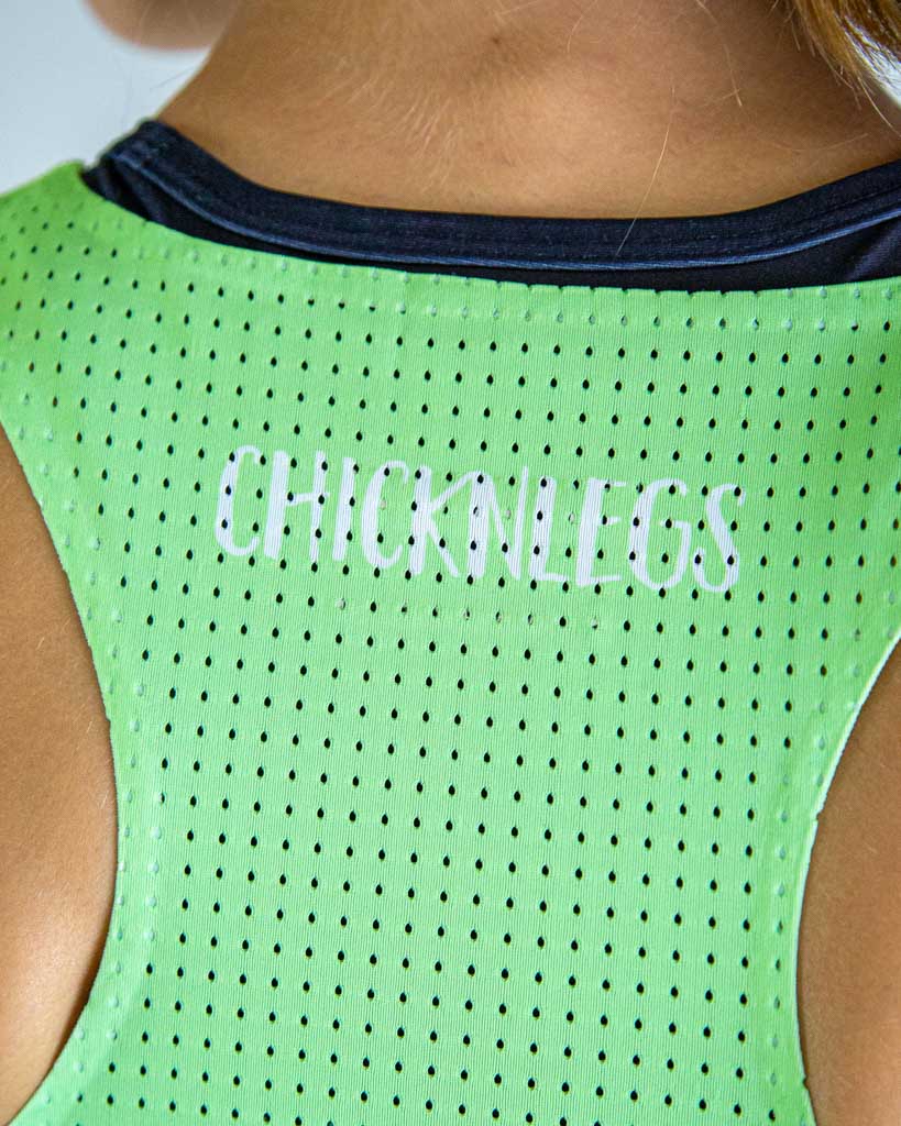 Close-up detail of ChicknLegs Women’s PWR Crop Top fabric, showing the mesh back texture, seamless stitching, and smooth lightweight material.