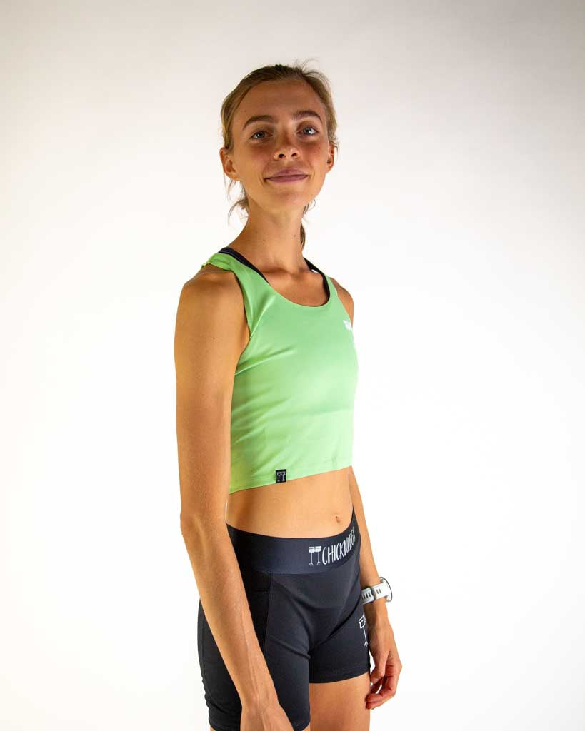 Right side view of ChicknLegs Women’s PWR Crop Top highlighting the cropped length and seamless neckline with lightweight, breathable fabric ideal for racing and training.