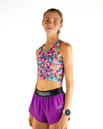 Left side view of ChicknLegs Women’s PWR Crop Top showing the sleek, unlined silhouette and seamless armhole for a smooth, chafe-free fit. Featured in the multi-colored tye-dye design!
