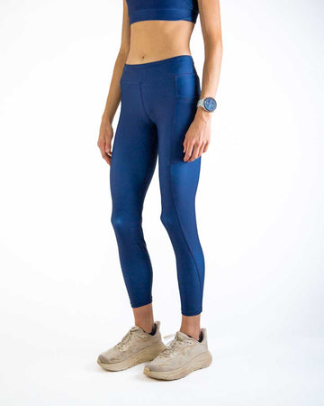 Left side view of ChicknLegs Women’s Navy Leggings showing the sleek silhouette, side pocket for essentials, and smooth performance fabric that prevents chafing.