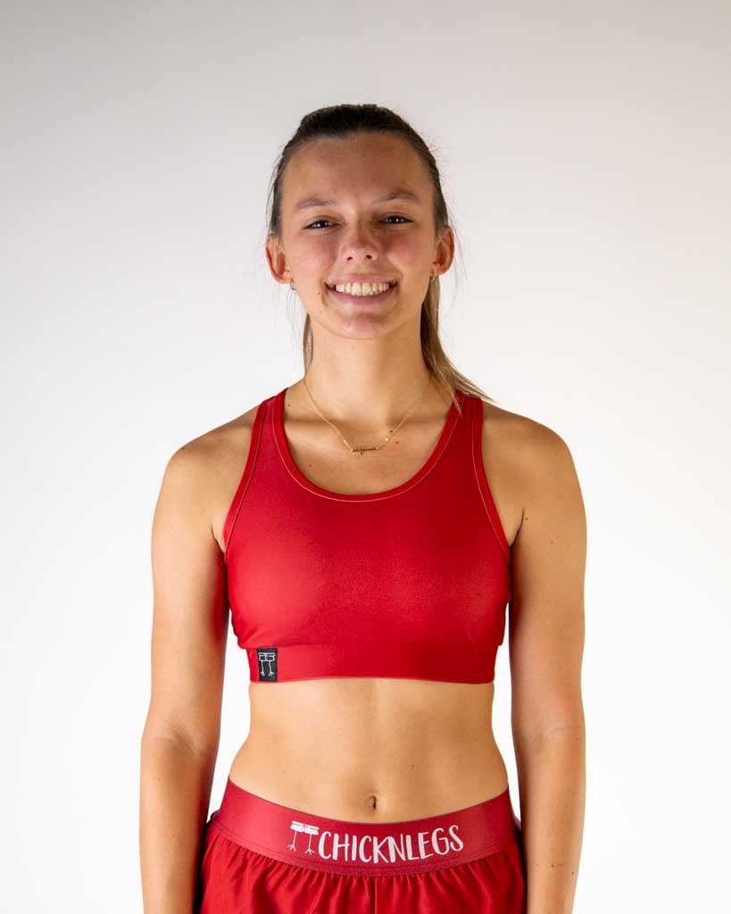 Front view of ChicknLegs women’s og sports bra with light  support, solid cardinal red fabric and scoop neckline.