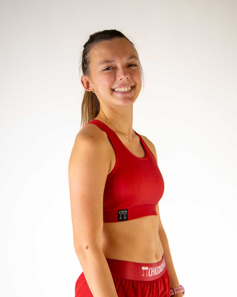 Right side view of ChicknLegs women’s og sports bra in solid cardinal red and elastic underband.