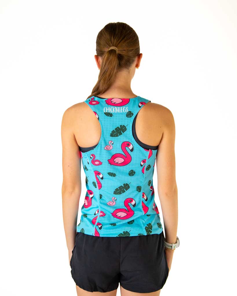 Back view of the runner is wearing ChicknLegs in the women's performance running singlet in the blue flamingo print. 