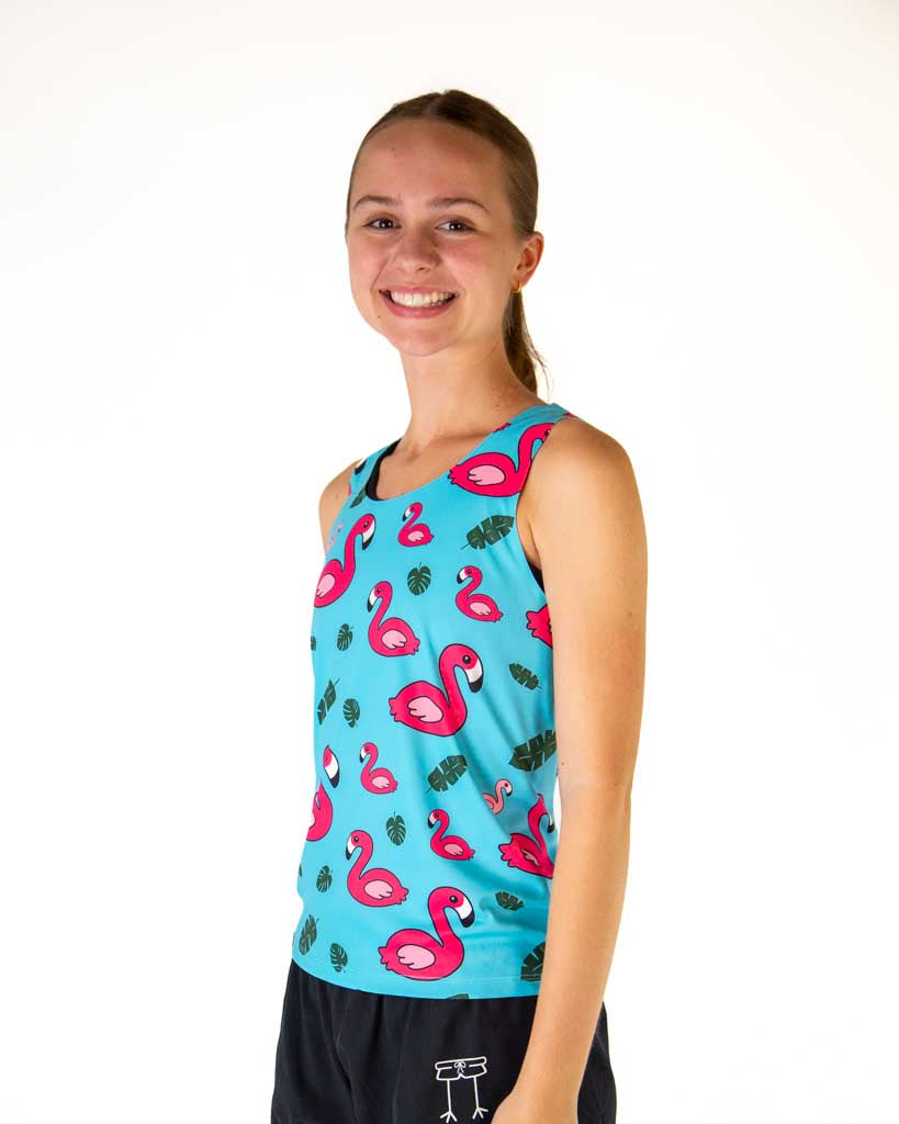 Runner is wearing ChicknLegs in the women's performance running singlet in the blue flamingo print. 