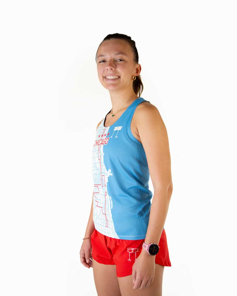 Runner is wearing ChicknLegs in the women's performance running singlet the design has the Chicago map route and logo on left chest.