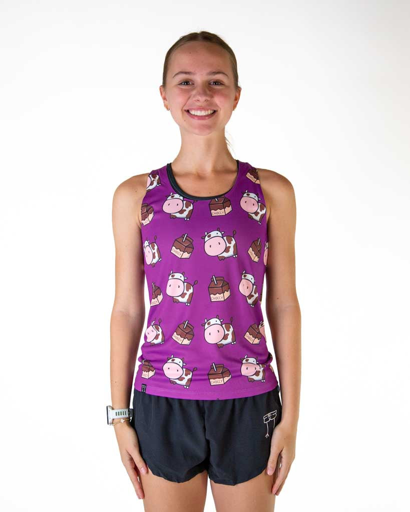 Front view of runner wearing ChicknLegs in the women's performance running singlet in the choccy cow design and purple background.