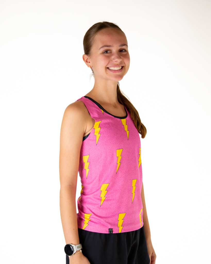 Right side view of the runner wearing ChicknLegs women's performance running singlet highlighting a breathable mesh back and Hot Pink Bolts design on lightweight fabric.