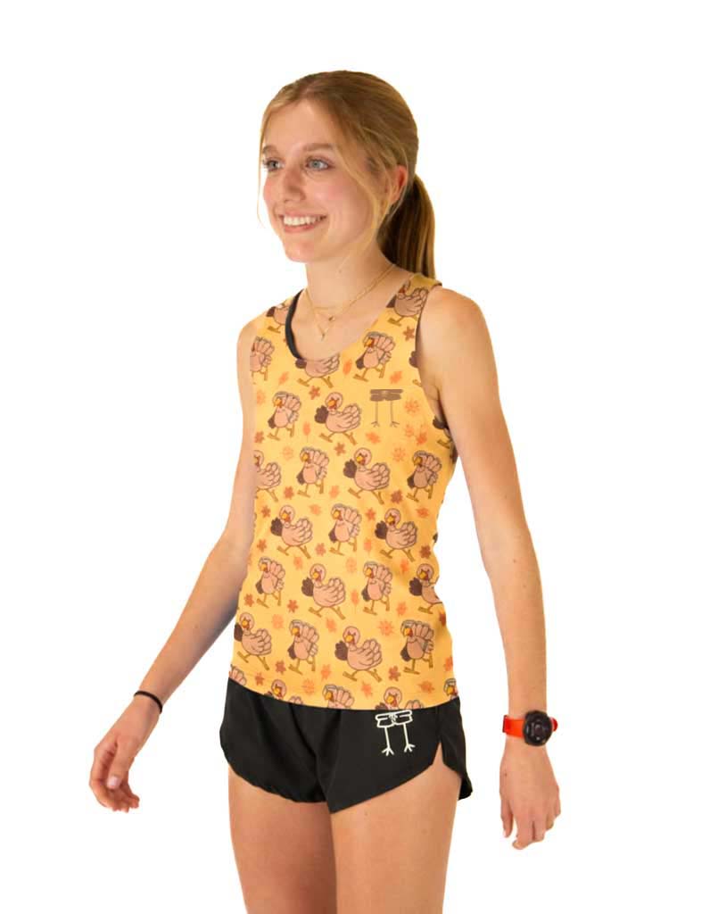 Runner is wearing ChicknLegs in the women's performance running singlet in the pardoned turkey design. This product has a breathable mesh back.