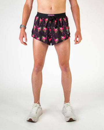 ChicknLegs Men's 2" DS drawstring shorts are shown on the runner. The print has hot pink flamingos with green leaves and a black background on it.