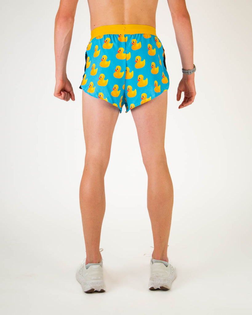 Back view of ChicknLegs men’s 2-inch split running shorts in blue with yellow rubber ducky pattern.