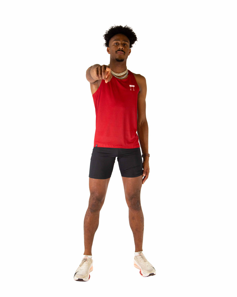 Full body view of model wearing the ChicknLegs Performance Running Singlet, featuring lightweight, breathable construction with mesh back panel and seamless armholes for a comfortable fit.