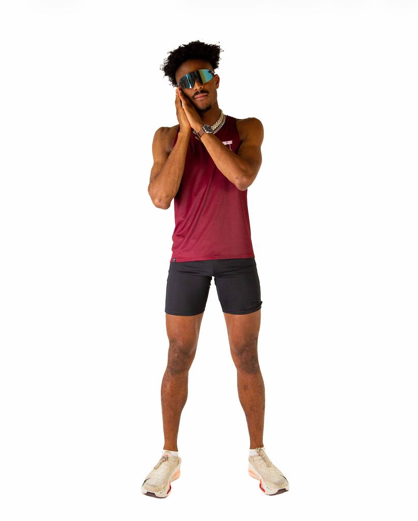 Full body view of model wearing the ChicknLegs Performance Running Singlet, featuring lightweight, breathable construction with mesh back panel and seamless armholes for a comfortable fit.