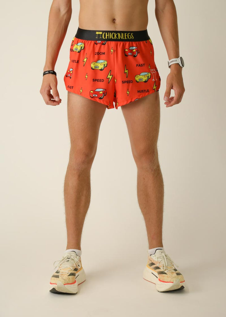 Model wearing Chicknlegs men's 2 inch split running shorts in the cars design, facing front.