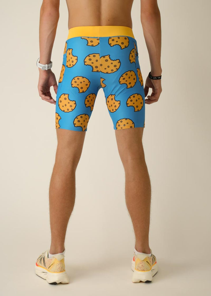 Model wearing Chicknlegs men's 8 inch half tights in the cookies design, back view.
