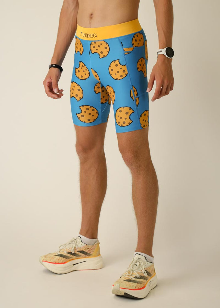Model wearing Chicknlegs men's 8 inch half tights in the cookies design, left side view.