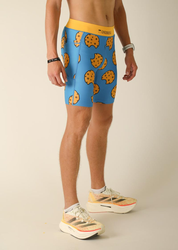 Model wearing Chicknlegs men's 8 inch half tights in the cookies design, right side view.