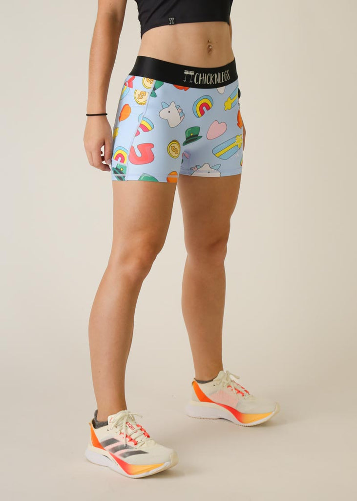 Model is wearing Chicknlegs women's 3 inch compression shorts for running in the charms design, facing right for right side view.