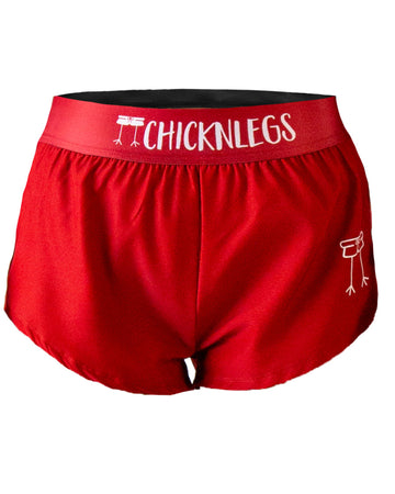 Close-up ghost image of ChicknLegs women’s 1.5-inch running shorts, solid cardinal red design and elastic waistband.