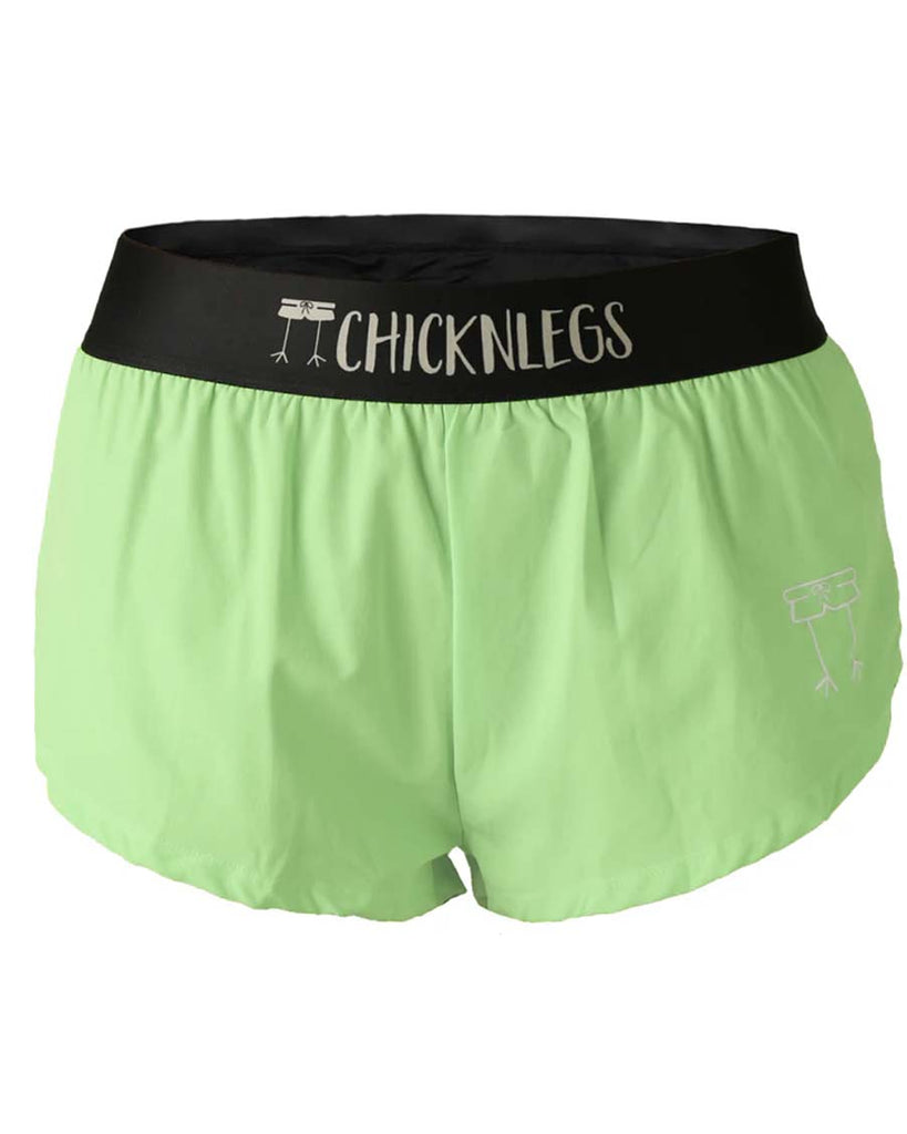 Ghost image of ChicknLegs women's 1.5 inch split running shorts in the Pickle Juice Green solid color. Black elastic waistband and a black mesh liner for full coverage.