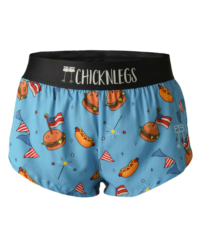 Chicknlegs women's 1.5 in split running shorts in the USA cookout design, as a ghost image. The print has burgers, hot dogs, sparklers, and stars over it. Great for runners who love America. 