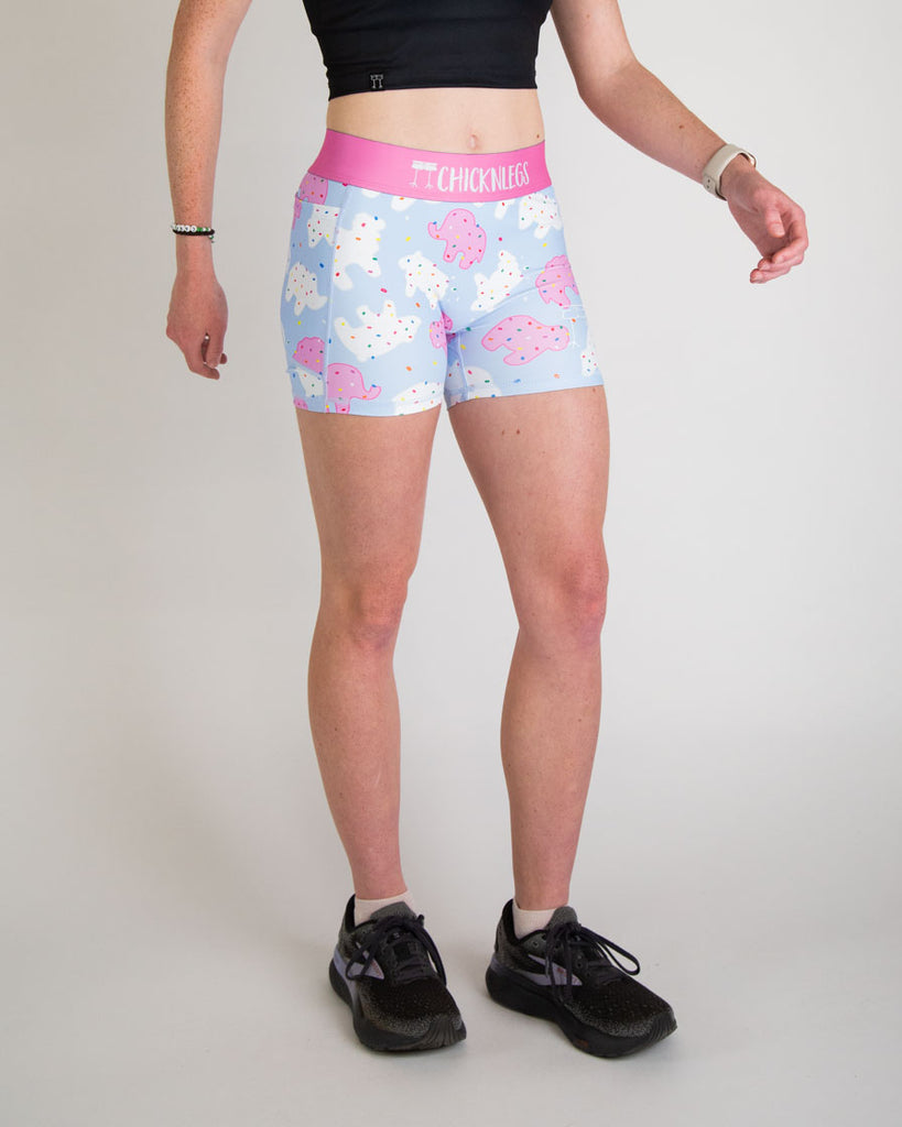 Runner is wearing ChicknLegs in the women's 3 in compression and spandex in the animal cookies design. The print has pink, white and blue on it with fun rainbow sprinkles on it. Great for working out, weightlifting, volley ball, running, and track and field!