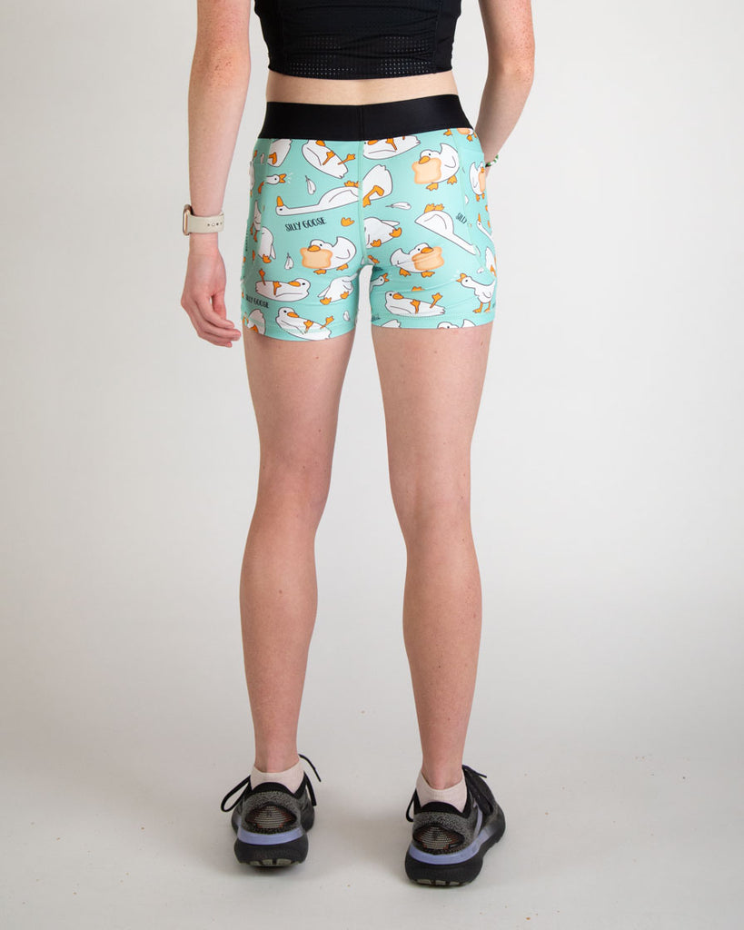 Runner is wearing ChicknLegs in the women's 3 in compression spandex shorts in the silly goose design. 