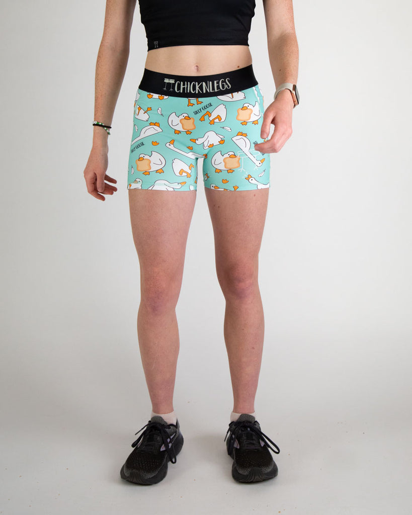 Runner is wearing ChicknLegs in the women's 3 in compression spandex shorts in the silly goose design. The print has white, orange and blue on it with a ton of geese. These shorts can be use for workouts, weight lifting, hiking, track and field!