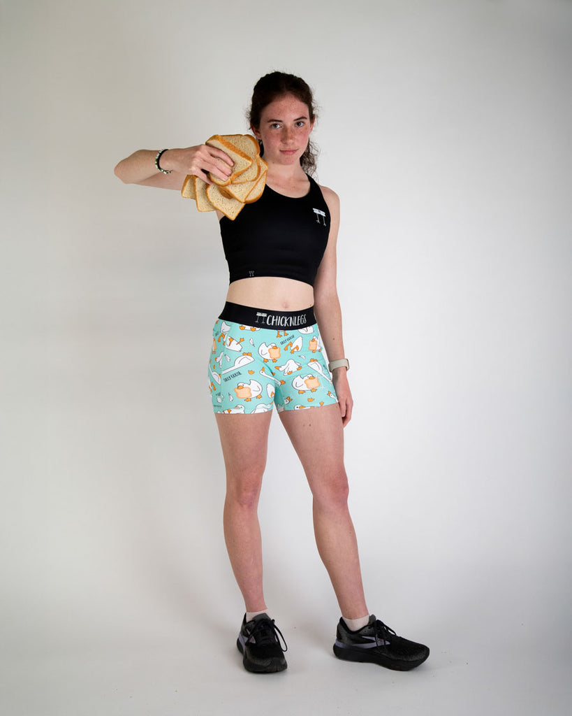 Runner is wearing ChicknLegs in the women's 3 in compression spandex shorts in the silly goose design. 