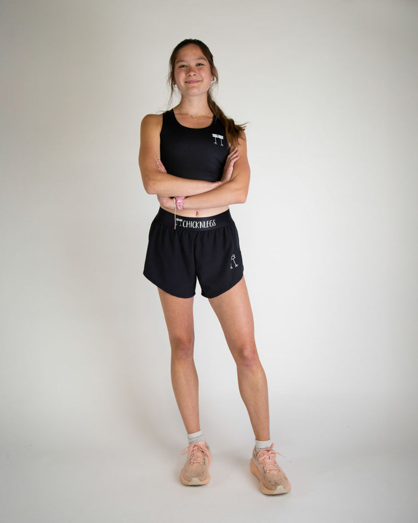 Runner is wearing ChicknLegs in the women's 4 in split running shorts in the solid black design. Good length for young, children, teens, women, of all ages. 