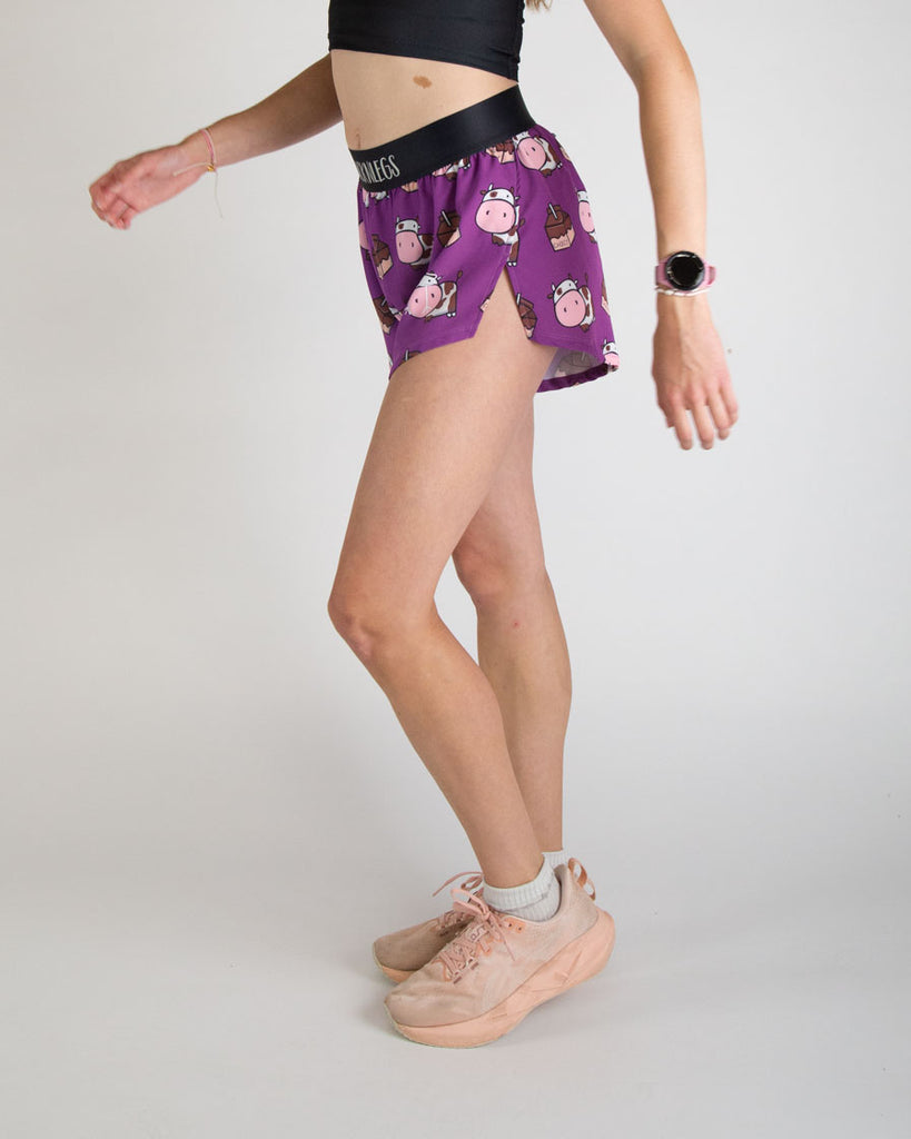 Runner is wearing ChicknLegs in the women's 4 in split running shorts in the choccy cows design. The print has brown cows on it with chocolate milk. Cute design for cow lovers.
