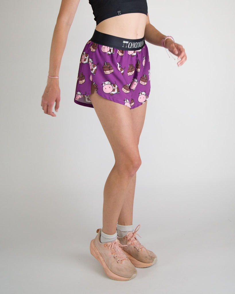 Runner is wearing ChicknLegs in the women's 4 in split running shorts in the choccy cow design. Great for matching outfits and having fits like the deep purple!