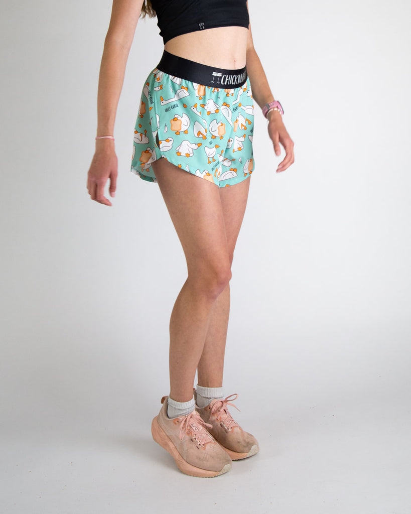 Runner is wearing ChicknLegs in the women's 4 in split running shorts in the silly goose design. The print has white, orange and blue on it with a bunch of geese. Great for workouts, weight lifting, working out, volley ball, running, hiking, and track and field!