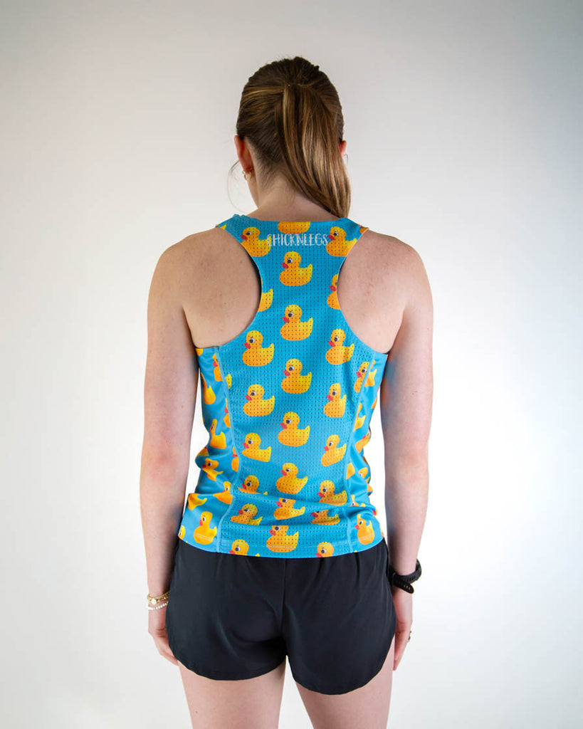 Back view of ChicknLegs women’s performance running singlet in blue with rubber ducky pattern, showing breathable mesh back.
