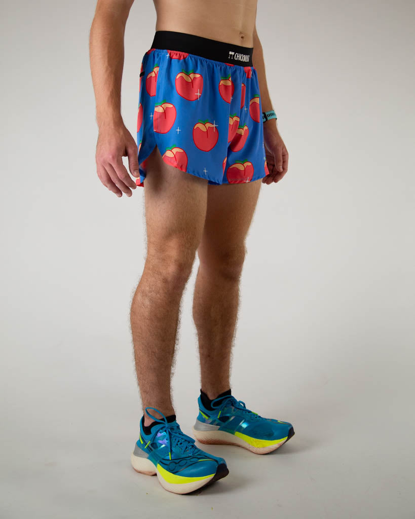 Right side view of ChicknLegs men’s 4-inch split running shorts with, breathable liner, blue background and juicy peaches on the design.