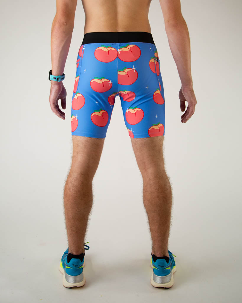 Back view of ChicknLegs men’s 8-inch half tights, breathable liner, blue background and juicy peaches design. 