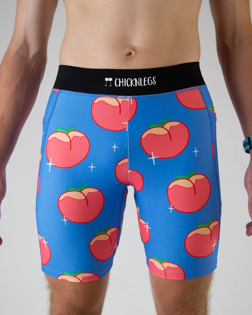 A close up photo of ChicknLegs men’s 8-inch half tights, breathable liner, blue background and juicy peaches design.