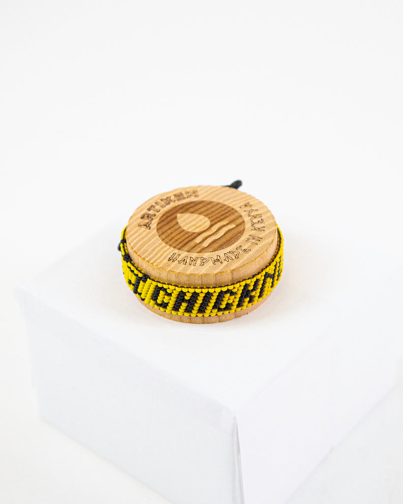 ChicknLegs artiken bracelet made with yellow and black beads. Great accessory for running and wearing with everyday clothes.