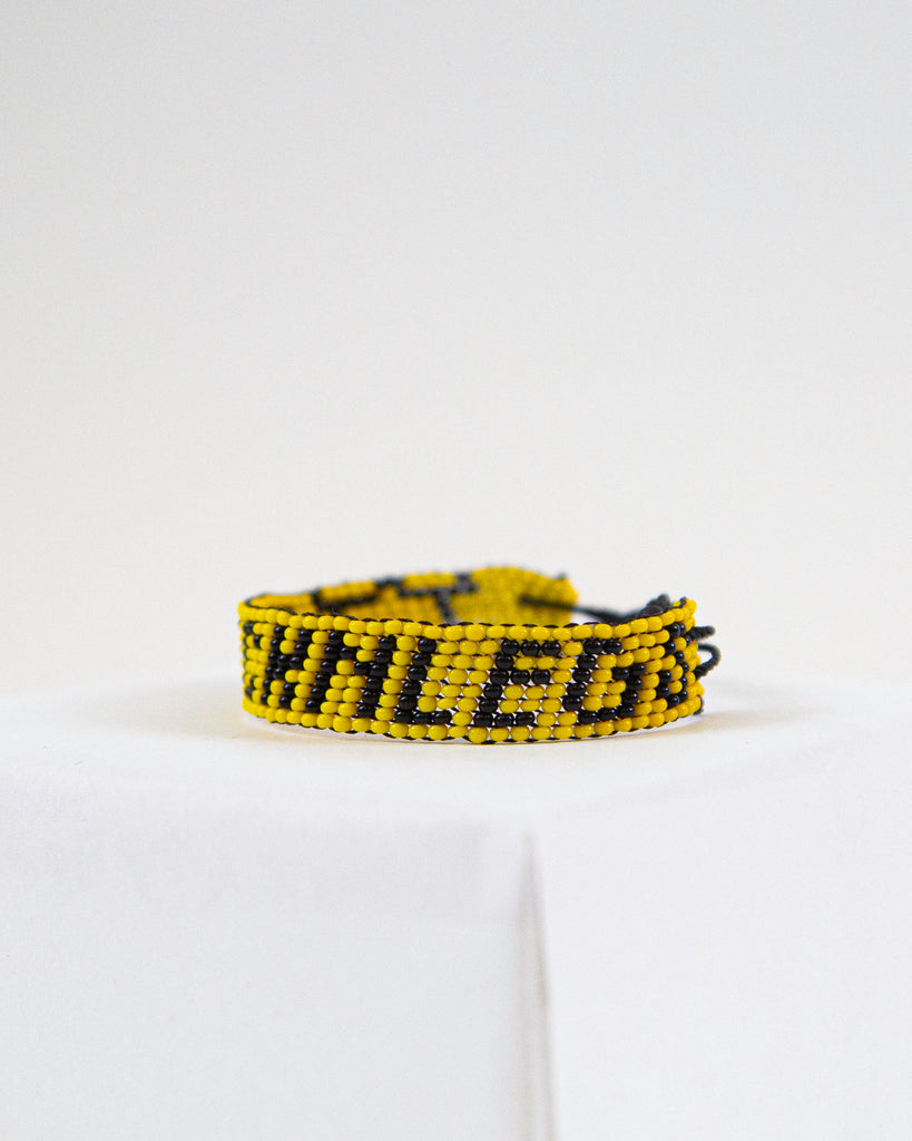 ChicknLegs artiken bracelet made with yellow and black beads. Great accessory for running and wearing with everyday clothes.