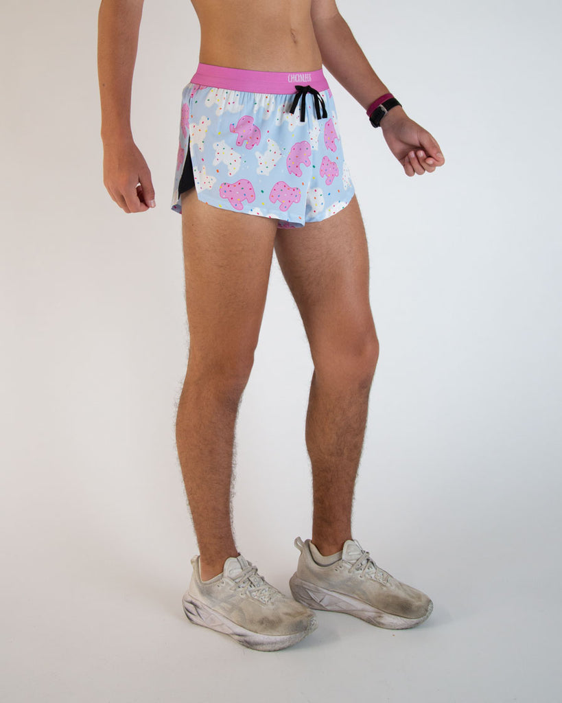 Runner is wearing ChicknLegs in the men's 2 in drawstrings split running shorts in the Animal Cookies design. These fun shorts have a blast of bright pink colors on the waistband and throughout the design.