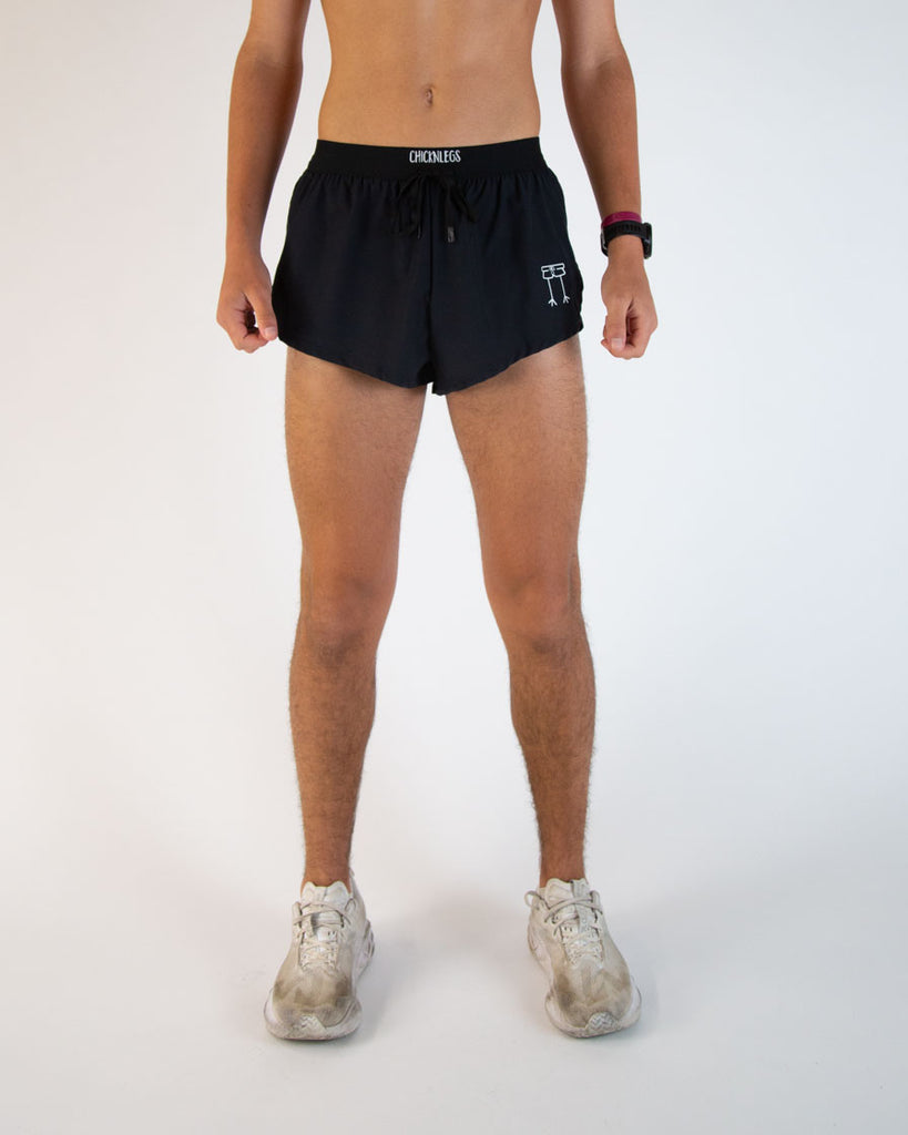 Runner is wearing ChicknLegs in the men's 2 in drawstring in split running shorts. These are the solid color black shorts. Great for matching fits or everyday wear!
