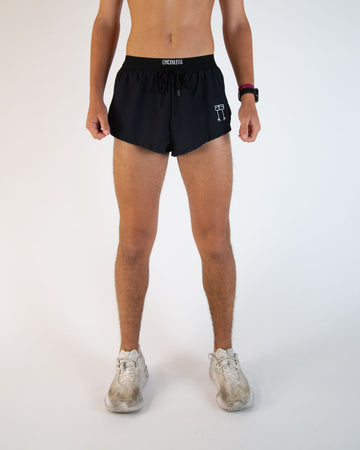 Runner is wearing ChicknLegs in the men's 2 in drawstring in split running shorts. These are the solid color black shorts. Great for matching fits or everyday wear!