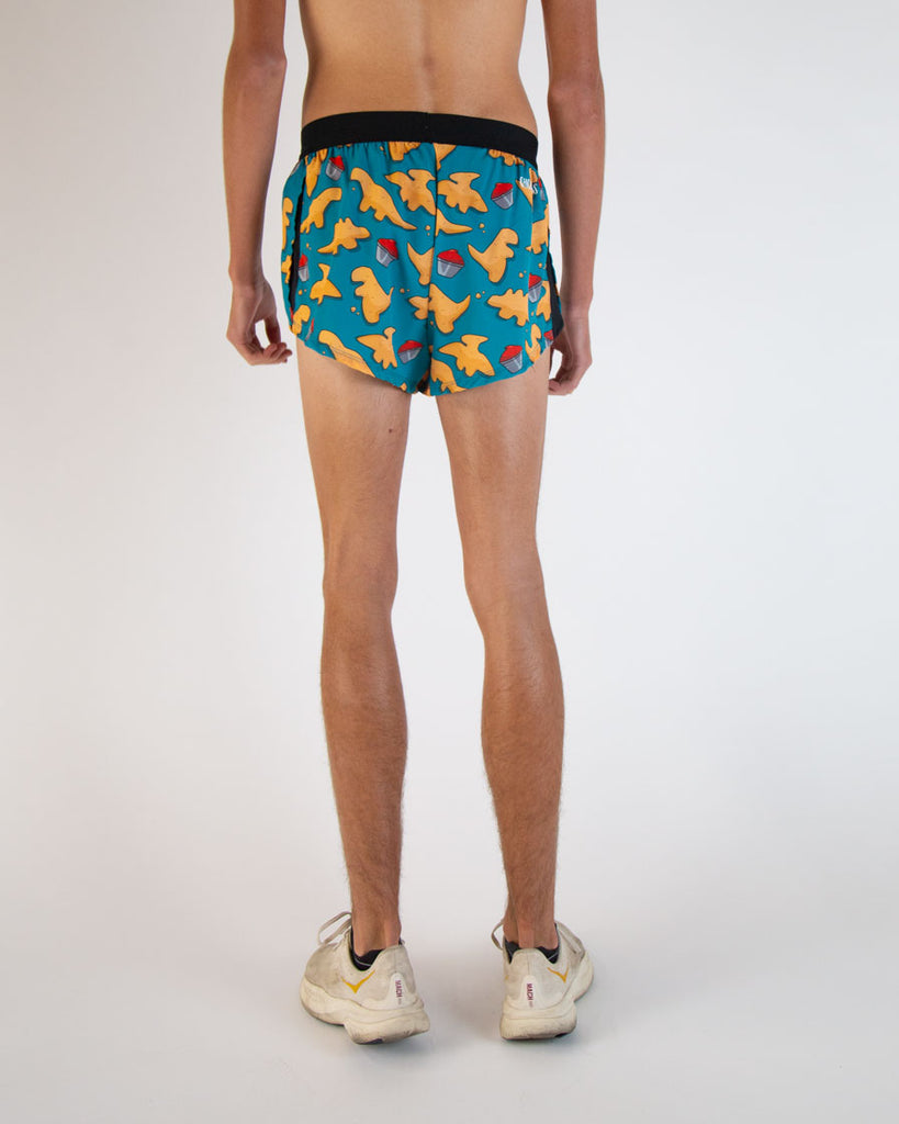 Runner is wearing ChicknLegs in the men's 2 in drawstrings in the split running shorts. The design has dinosaur  chicken nuggets on them with ketchup sauces. The back of the shorts are shown in this image.
