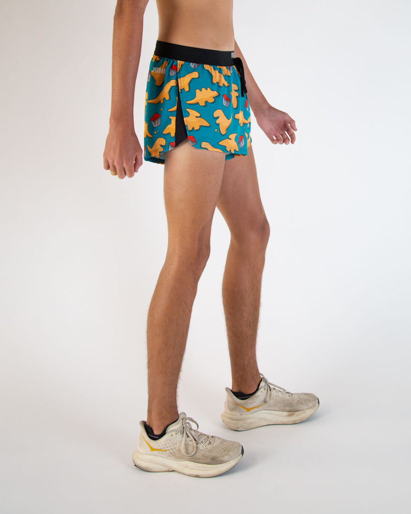 Runner is wearing ChicknLegs in the men's 2 in drawstrings in the split running shorts. The design has dinosaur  chicken nuggets on them with ketchup sauces. Great for running, track and field, hiking, weight lifting, working out and more!