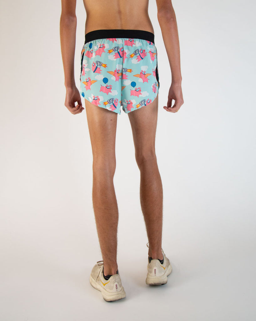 Runner is wearing ChicknLegs in the men's 2 in drawstrings in the split running shorts in the flying pig design. The back view is shown in this image.
